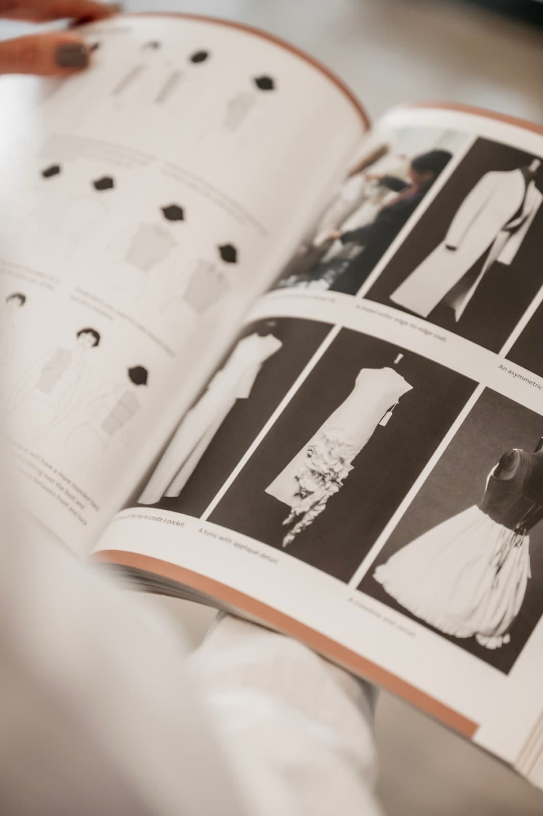 Pages of a style guide fanned mid-turn